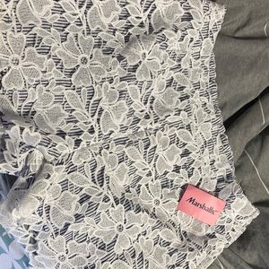 White and blue shorts with floral print.